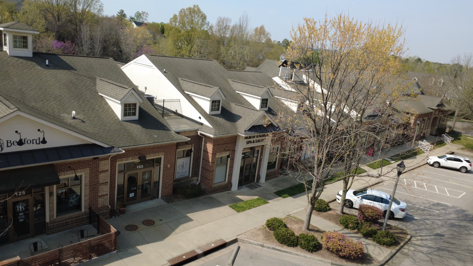 The Shoppes at Bedford storefronts including a spa and salon