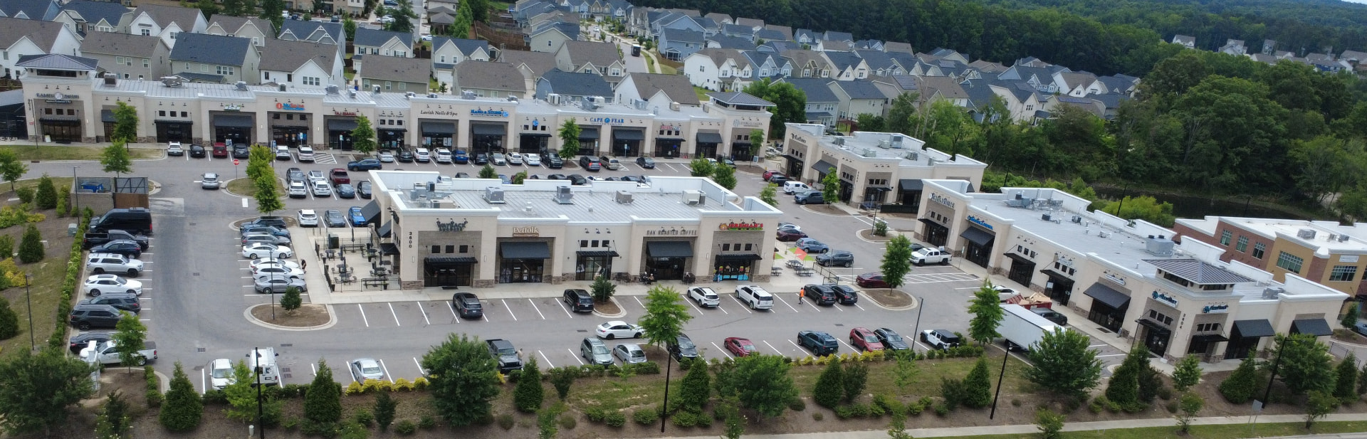 Aerial view of a Wake Forest shopping center near Heritage