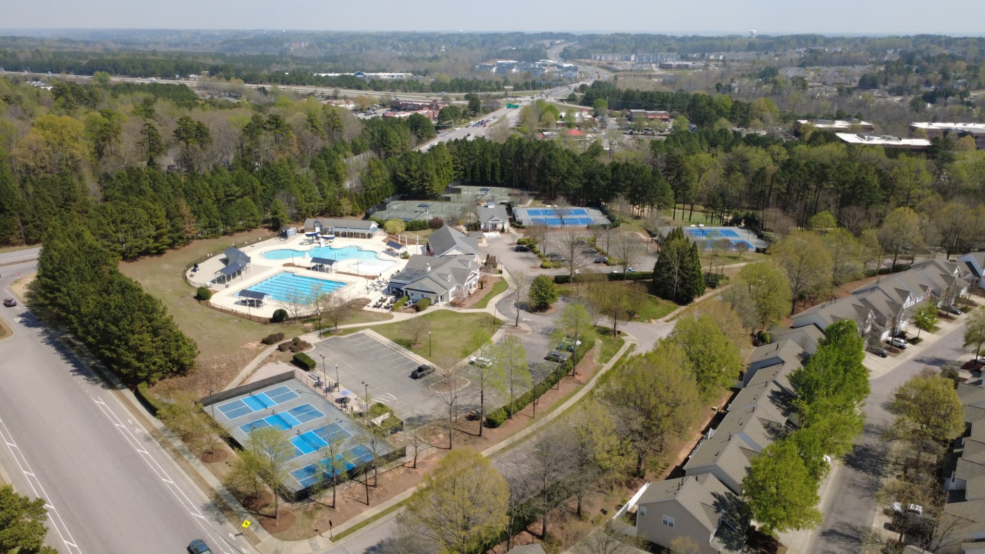 Aerial view of Wakefield's recreation complex with pools, tennis and pickleball courts, and clubhouse